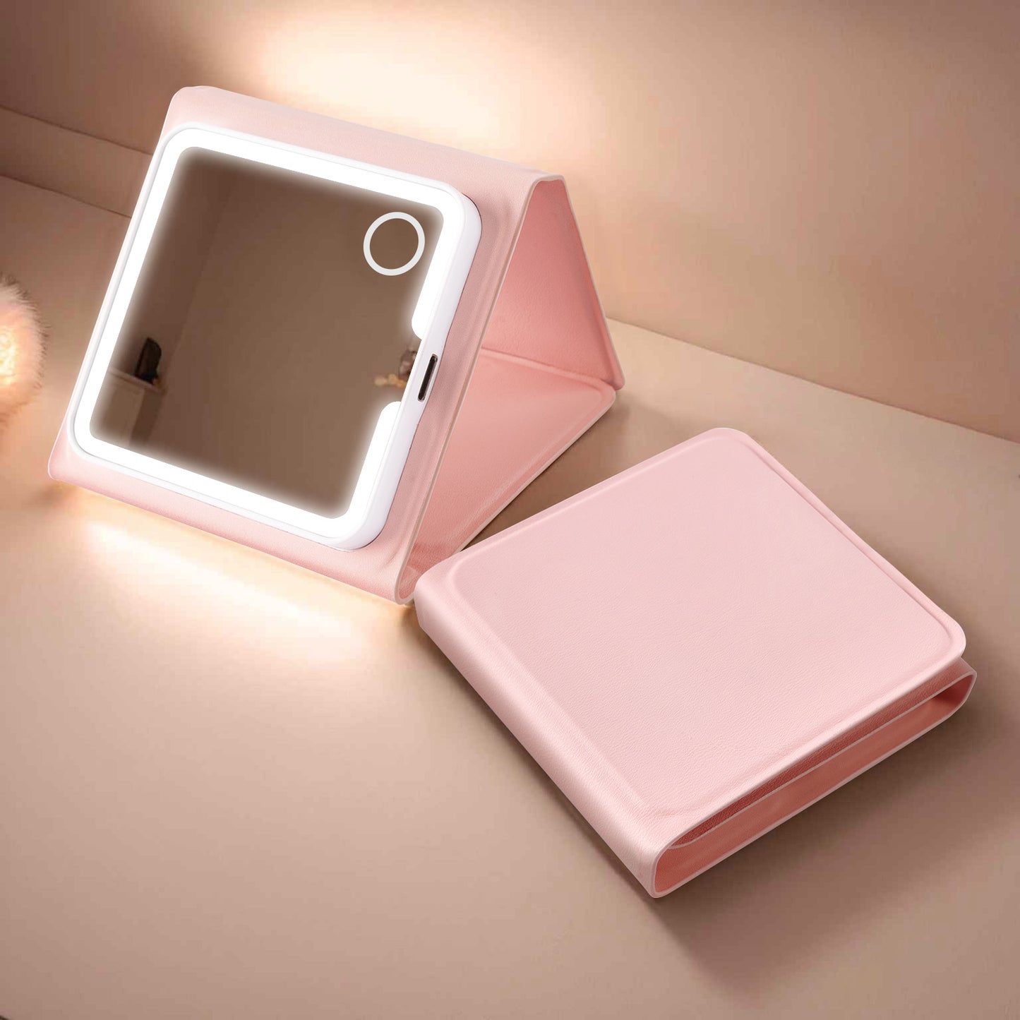 Square Pink LED Lighted Mirror Standing On Desk Next To Case